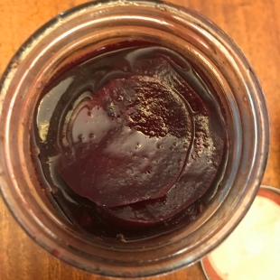 a jar of pickled beet from a bird's eye view